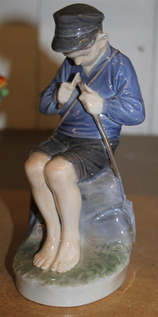 Royal Copenhagen capped boy seated and whittling, marked SF905, 20cm